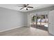 This bedroom features neutral paint, vinyl floor, and access to the pool at 115 24Th W St, Bradenton, FL 34205