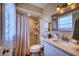 Well-maintained bathroom featuring a tiled shower, neutral color scheme, and modern fixtures at 13575 Martha Ave, Port Charlotte, FL 33981