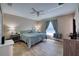 Inviting bedroom with wood-look flooring, ample natural light, and a soothing color palette at 13575 Martha Ave, Port Charlotte, FL 33981
