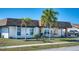 Charming single-story home with stone accents, well-maintained landscaping, and mature palm trees at 13575 Martha Ave, Port Charlotte, FL 33981