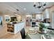 Modern kitchen with stainless steel appliances, granite countertops, island, and stylish dining area at 13575 Martha Ave, Port Charlotte, FL 33981