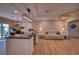 Bright living area flowing into the kitchen, featuring a modern island, and comfortable seating at 13575 Martha Ave, Port Charlotte, FL 33981