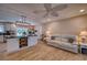 Open concept living and kitchen area with island, modern lighting, and inviting seating area at 13575 Martha Ave, Port Charlotte, FL 33981
