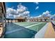 Well-maintained shuffleboard courts with ample seating, perfect for community recreation at 13575 Martha Ave, Port Charlotte, FL 33981