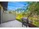 Outdoor patio featuring a gas grill and a privacy fence at 17128 Blowfish Dr, Nokomis, FL 34275