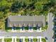 Aerial view showcases the townhome's layout, parking, and landscaping at 17136 Blowfish Dr, Nokomis, FL 34275