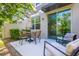 Outdoor patio with comfortable seating area, dining table and shade umbrella at 17136 Blowfish Dr, Nokomis, FL 34275