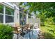 Outdoor patio with dining table, umbrella and chairs at 17136 Blowfish Dr, Nokomis, FL 34275