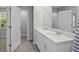 Elegant bathroom showcasing a dual vanity and separate shower with modern tiled floors at 17136 Blowfish Dr, Nokomis, FL 34275