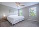 Serene bedroom with plush carpeting, natural light, and minimalist decor for a peaceful retreat at 17136 Blowfish Dr, Nokomis, FL 34275