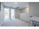 Large bonus room includes neutral paint, carpet, and natural lighting at 17136 Blowfish Dr, Nokomis, FL 34275