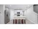 Well-lit kitchen featuring stainless steel appliances, a center island, and bar stool seating at 17136 Blowfish Dr, Nokomis, FL 34275