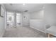 Carpeted loft area with a desk and access to bedrooms at 17136 Blowfish Dr, Nokomis, FL 34275
