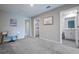 View of the loft featuring a desk and access to the laundry room and bathroom at 17136 Blowfish Dr, Nokomis, FL 34275