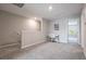 Cozy upstairs loft area with neutral walls, carpet, and a small desk setup at 17136 Blowfish Dr, Nokomis, FL 34275