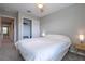 Cozy bedroom with a ceiling fan, neutral walls, carpet, and closet for storage at 17136 Blowfish Dr, Nokomis, FL 34275