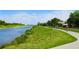 Scenic pathway alongside a tranquil river, ideal for biking and enjoying nature at 17136 Blowfish Dr, Nokomis, FL 34275