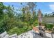 Outdoor patio featuring dining table and chairs surrounded by lush greenery at 17136 Blowfish Dr, Nokomis, FL 34275