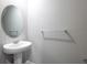 Clean and simple powder room featuring a pedestal sink and minimal design at 17136 Blowfish Dr, Nokomis, FL 34275
