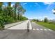 Well-maintained path perfect for walking or cycling, surrounded by beautiful plants and greenery at 17136 Blowfish Dr, Nokomis, FL 34275