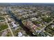 Stunning aerial view of a waterfront property with canal access and lush landscaping at 18576 Alphonse Cir, Port Charlotte, FL 33948