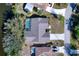 Overhead view of a home with a pool, patio, and a well-manicured lawn at 18576 Alphonse Cir, Port Charlotte, FL 33948