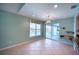 Bright dining area featuring tile floors, pool views, and built-in desk space at 18576 Alphonse Cir, Port Charlotte, FL 33948