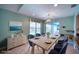 Dining room with modern table set, seaside decor, and view of the pool at 18576 Alphonse Cir, Port Charlotte, FL 33948
