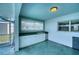 Exterior covered patio with a utility sink, white cabinets, and a view to the backyard at 18576 Alphonse Cir, Port Charlotte, FL 33948