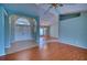 Open foyer with tile flooring leading into a spacious living area, showcasing an airy layout at 18576 Alphonse Cir, Port Charlotte, FL 33948