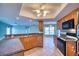Well-lit kitchen featuring granite countertops, wooden cabinetry, and modern appliances at 18576 Alphonse Cir, Port Charlotte, FL 33948