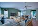 Comfortable living room with vaulted ceilings and a blue accent rug at 18576 Alphonse Cir, Port Charlotte, FL 33948