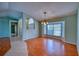 Bright living room featuring hardwood flooring, large window with natural light, and modern decor at 18576 Alphonse Cir, Port Charlotte, FL 33948