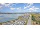 Lakeside community with a beautiful waterfront view and well-planned residential layout under a cloudy blue sky at 1944 Vang Ln, Sarasota, FL 34240