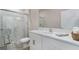 Bright bathroom with a glass-enclosed shower, modern fixtures, and a vanity with marble countertop at 1944 Vang Ln, Sarasota, FL 34240