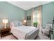 Serene bedroom with soft colors, natural light, and comfortable furniture for relaxation at 1944 Vang Ln, Sarasota, FL 34240