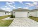 Charming home featuring a spacious two-car garage with a paved driveway and manicured lawn at 1944 Vang Ln, Sarasota, FL 34240