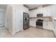 Modern kitchen with white cabinets, stainless steel appliances, and plenty of counter space for cooking at 1944 Vang Ln, Sarasota, FL 34240
