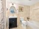 Well-lit bathroom with vanity, tiled walls, and standard bath and shower at 2424 Placida Rd # C104, Englewood, FL 34224