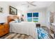 Inviting bedroom with natural light, complemented by a ceiling fan and coastal-themed accents at 2424 Placida Rd # C104, Englewood, FL 34224