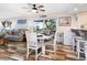 Comfortable dining area with a table, chairs, a bar area and views to the living room at 2424 Placida Rd # C104, Englewood, FL 34224