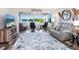 Comfortable living room featuring a cozy couch, a TV, and a gorgeous view of the water at 2424 Placida Rd # C104, Englewood, FL 34224