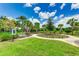 A beautifully landscaped community park featuring a bench, little library and lush greenery at 3517 Big Sky Way, Bradenton, FL 34211