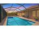 Gorgeous screened pool offers a private and relaxing retreat with ample seating area at 3517 Big Sky Way, Bradenton, FL 34211