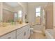 Bright bathroom features marble countertops, a vanity and a shower-tub combination at 3831 Creekside Park Dr, Parrish, FL 34219