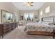 Bedroom with neutral color scheme, natural light, and elegant furnishings at 3831 Creekside Park Dr, Parrish, FL 34219