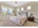 Inviting bedroom with a queen bed, soft natural lighting and plush carpet at 3831 Creekside Park Dr, Parrish, FL 34219
