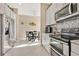 Bright kitchen features stainless appliances, mosaic backsplash, and a connected dining area at 3831 Creekside Park Dr, Parrish, FL 34219