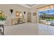 An elegant living space showcasing stylish decor and seamless access to the outdoor patio and pool at 3831 Creekside Park Dr, Parrish, FL 34219