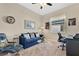 Cozy home office with comfortable seating, a work desk, and a window for natural light at 3831 Creekside Park Dr, Parrish, FL 34219